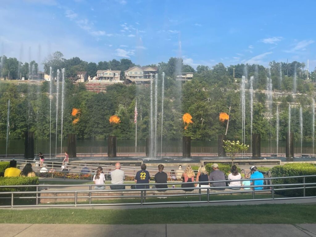 Free fountain show at Branson Landing with Lake Taneycomo in the background.