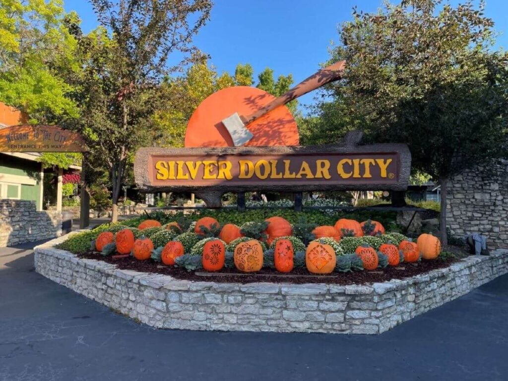 The iconic log and axe sign at entrance of Silver Dollar City.