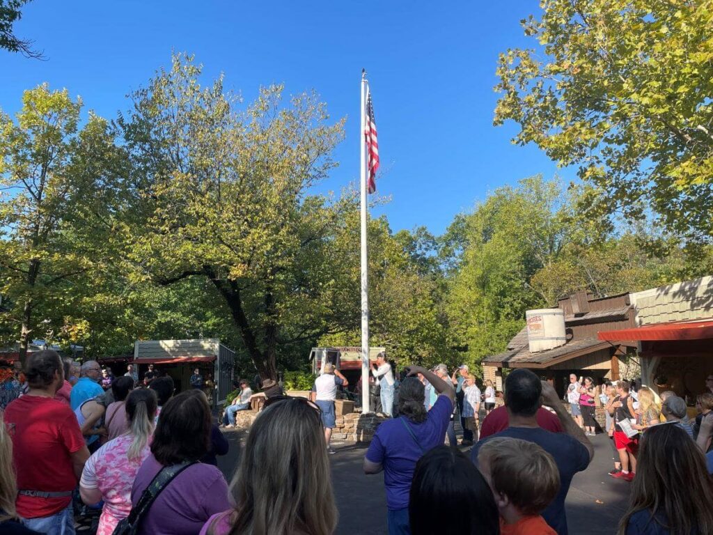 Flag being raised at Silver Dollar City's opening ceremony