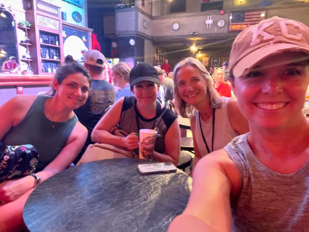 Four friends waiting for the saloon show to start at Silver Dollar City